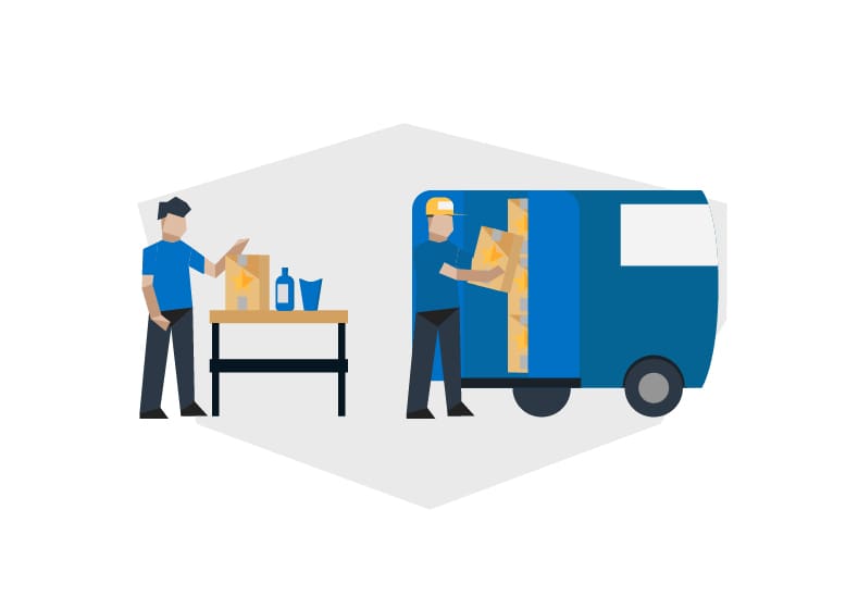 two men packing boxes onto a truck