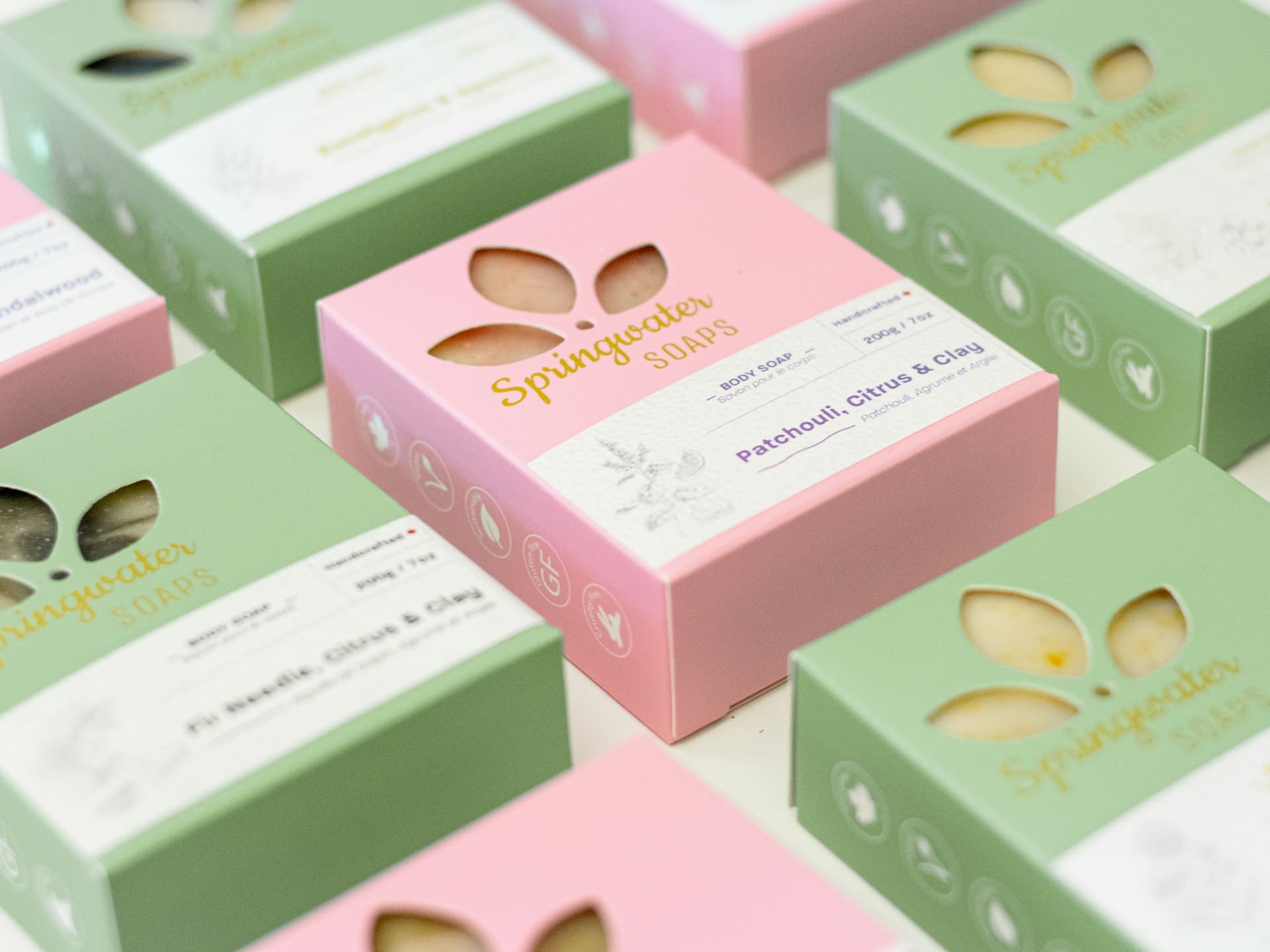 Bars of soap in unique packaging with shapes cut out of the box