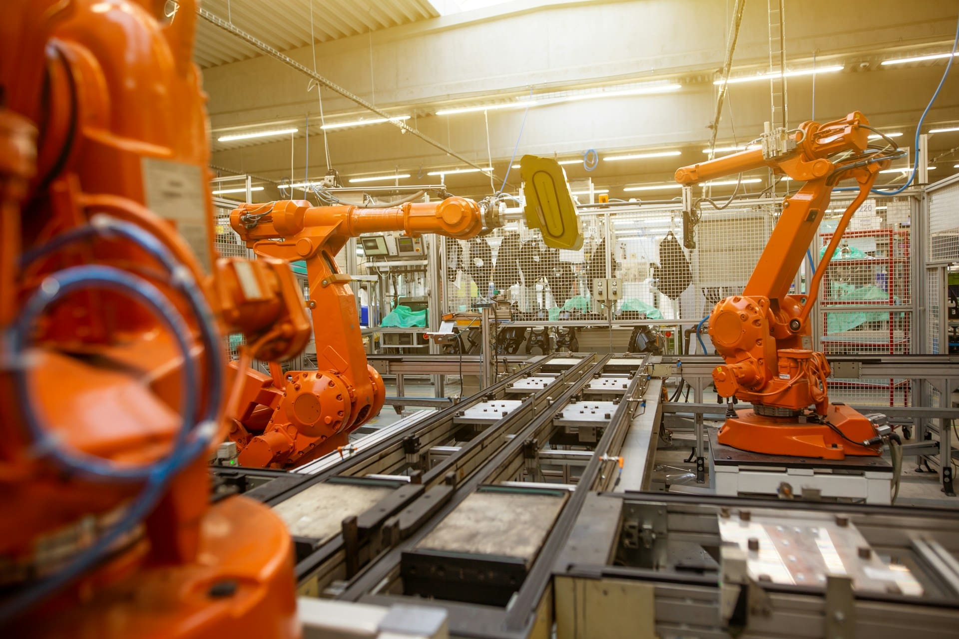 Factory line with robotic arms and machines to assemble items