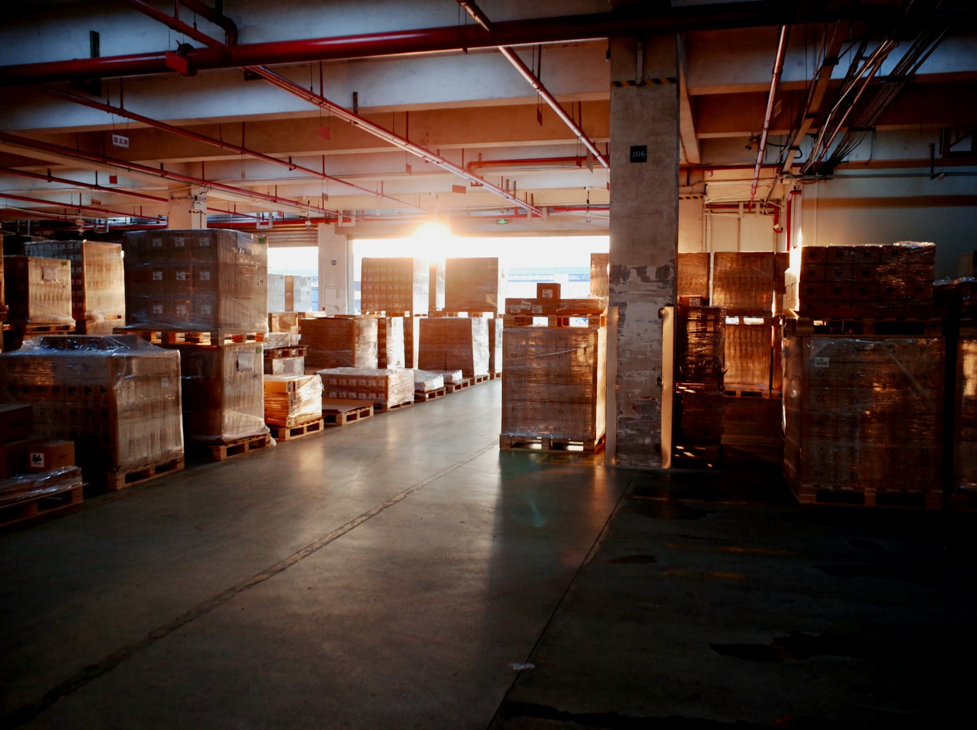 boxes, cases, pallets of wholesale goods in a warehouse